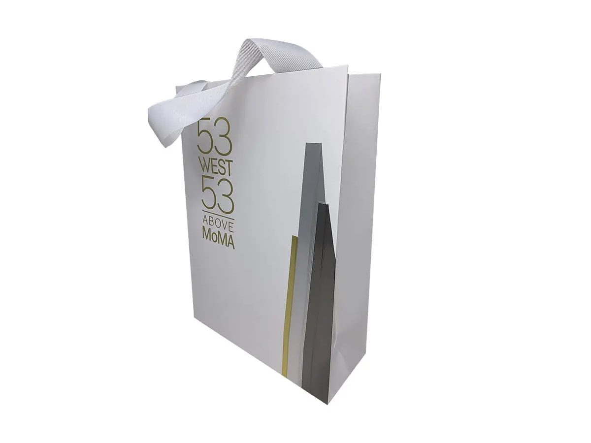 53 West 53 silver shopping bag with tower-silhouette print and ribbon handle by VSL Packaging
