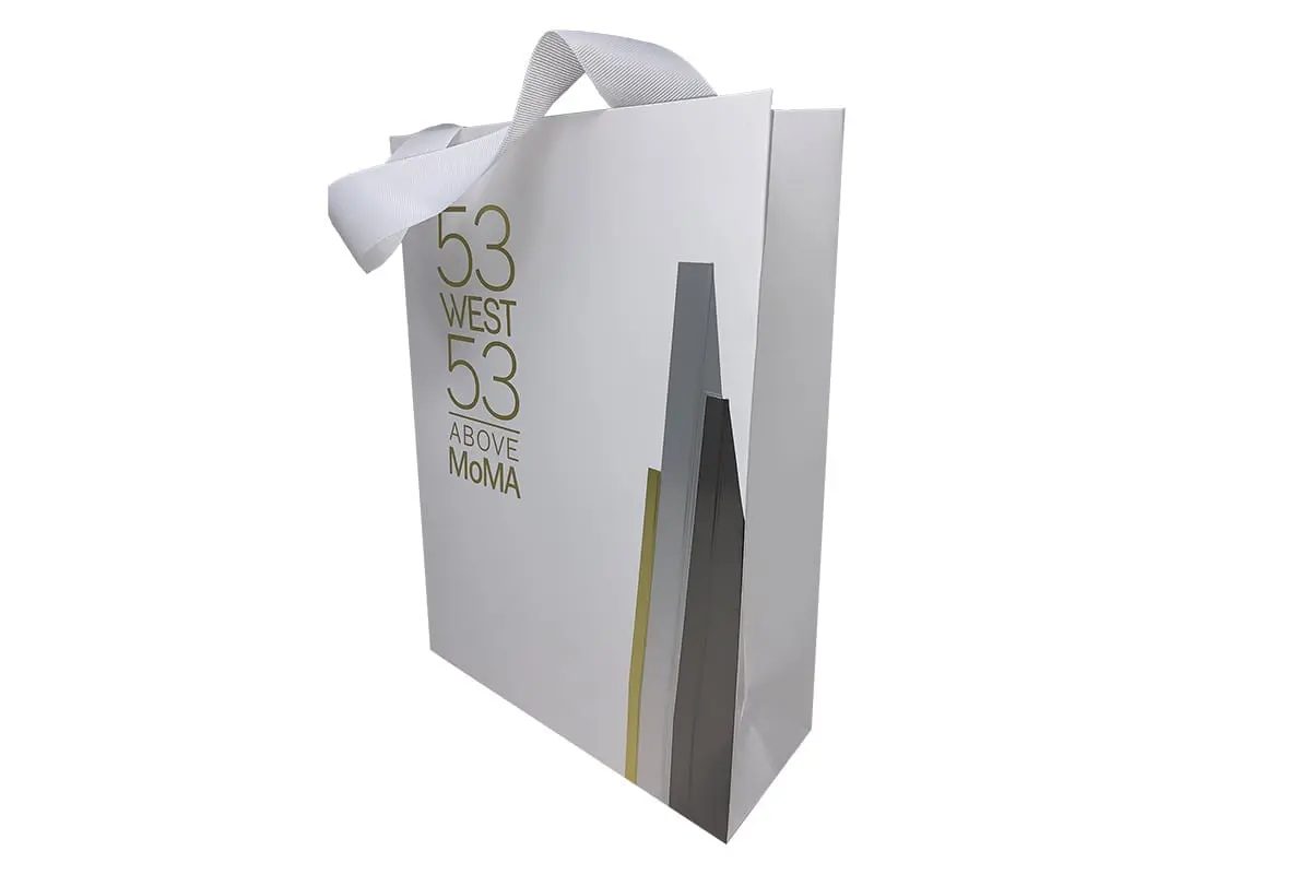 53 West 53 silver shopping bag with an architectural tower print by VSL Packaging