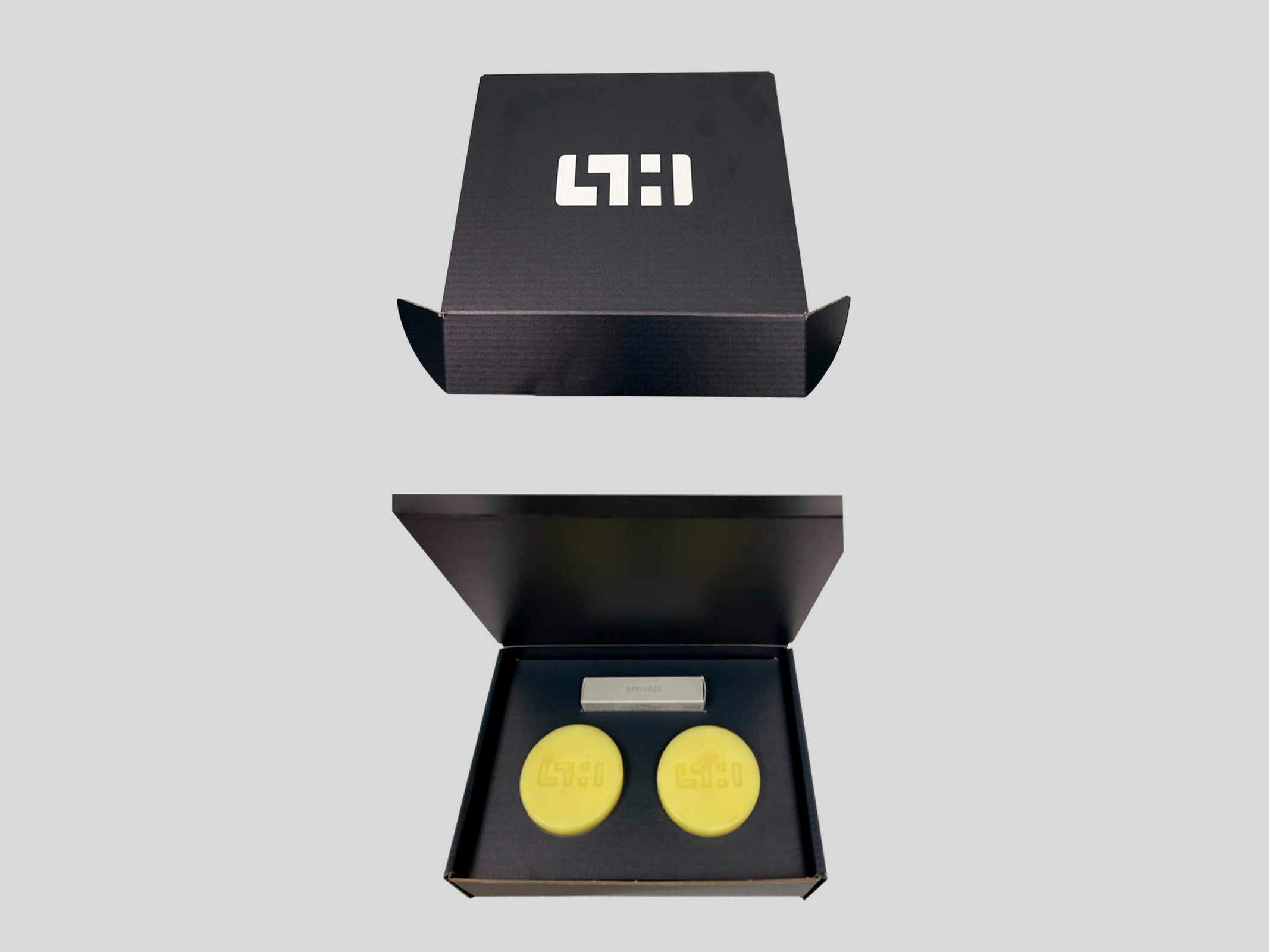 Lede black rigid box shown closed and open by VSL Packaging