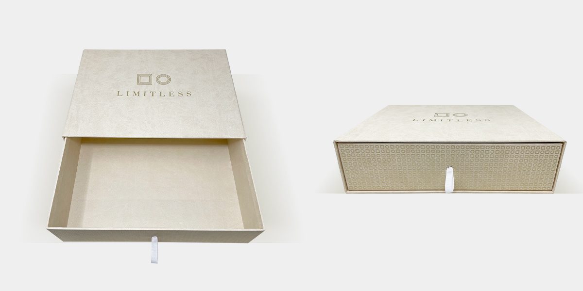 Limitless textured drawer box with pull ribbon, shown open and closed