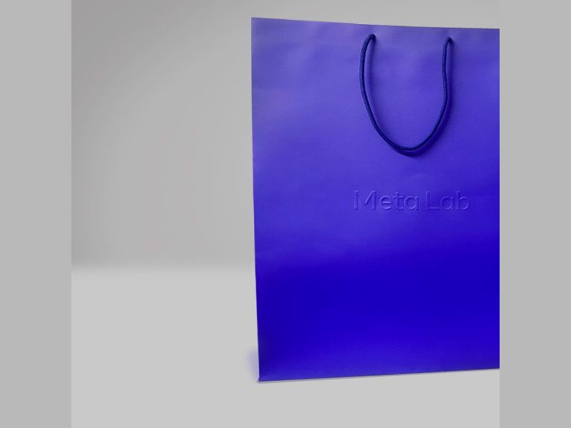 Metalab royal blue shopping bag with a debossed wordmark by VSL Packaging