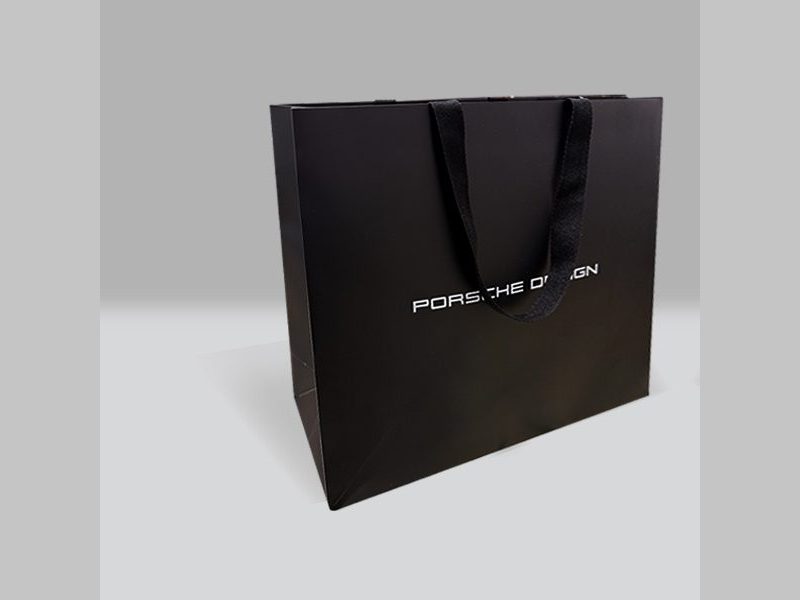 Porsche Design black shopping bag with ribbon handles by VSL Packaging